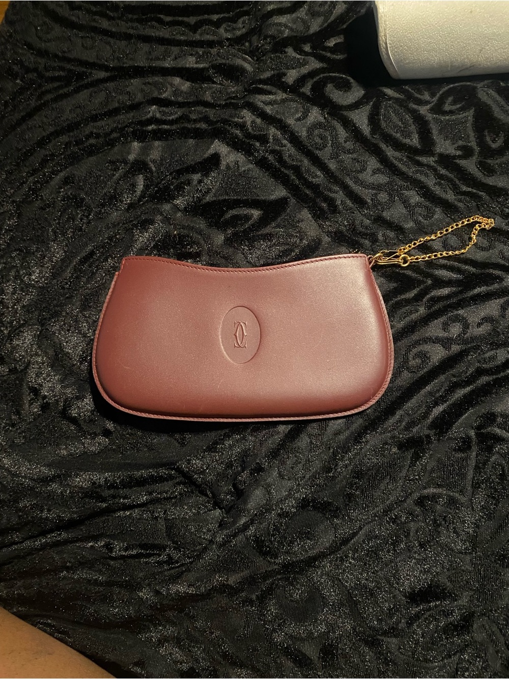 Authentic Cartier Burgundy Leather Wristlet with Gold Chain